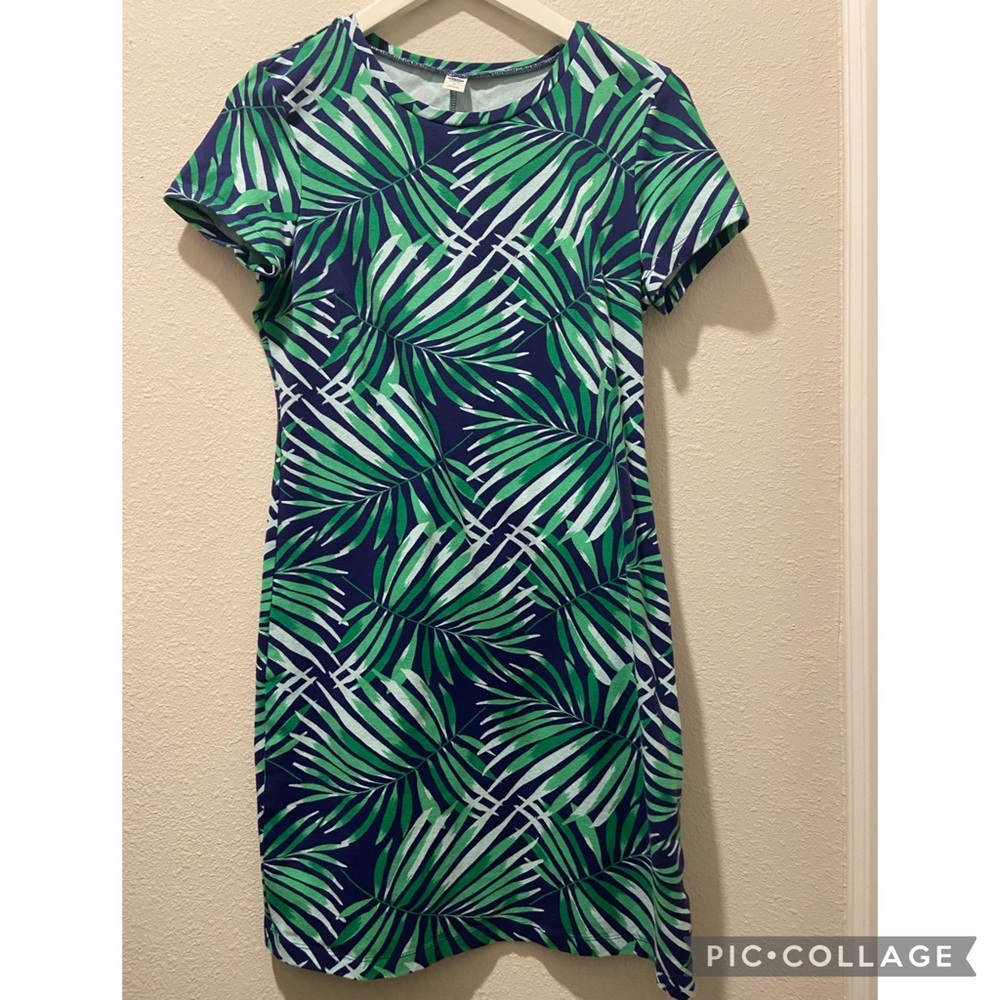 Old Navy size M dress with palm tree leaves as design with navy blue background